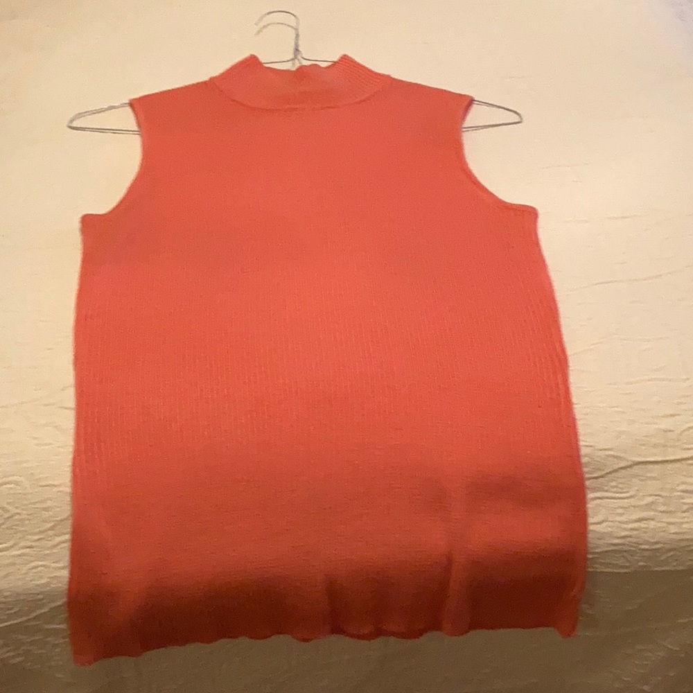 Coral sleeveless turtleneck